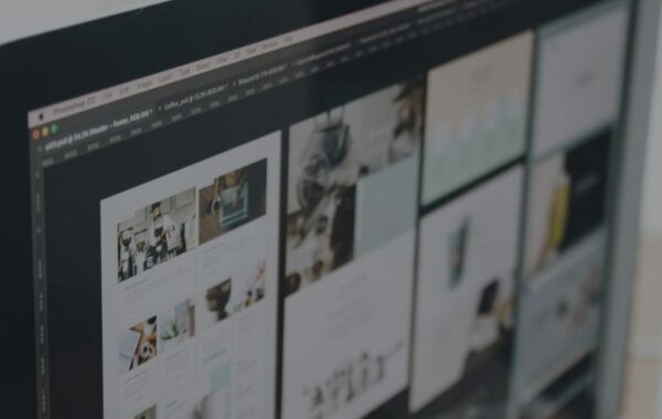 Freelancer and client discussing web development project in a consultation in office.